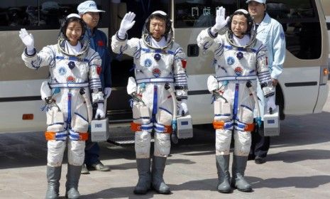 Chinese astronauts, including the country&amp;#039;s first female space traveler (left), before liftoff on June 16.