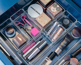 A makeup drawer divided up with organizers