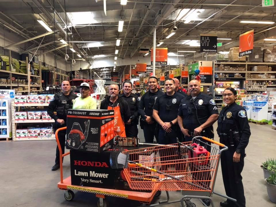 Adrian Salgado with the police officers who bought him new equipment.