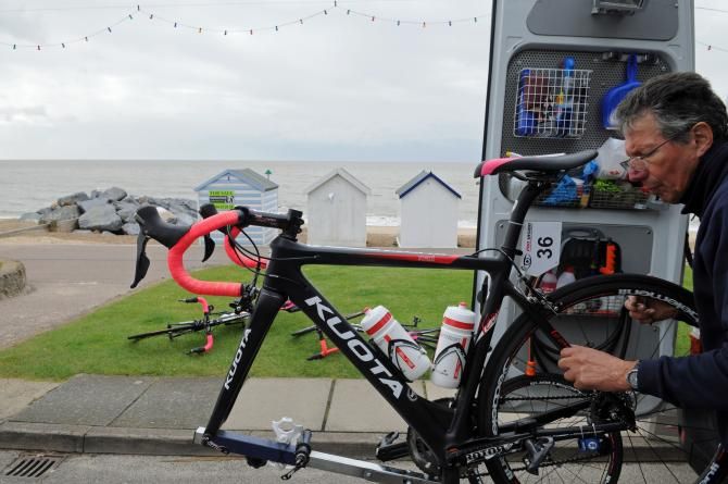 The Team Mexico Faren mechanic works on Elena Cecchini's bike