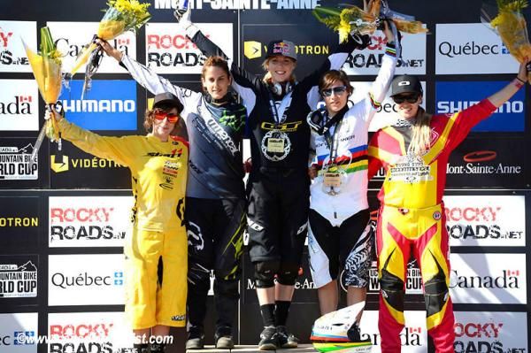 Elite women's downhill podium at Mont-Sainte-Anne at the World Cup: Emilie Siegenthaler (Scott11), Myriam Nicole (Commencal/Riding Addiction), Rachel Atherton (GT), Emmeline Ragot (MS Mondraker), Micaylo Gatto