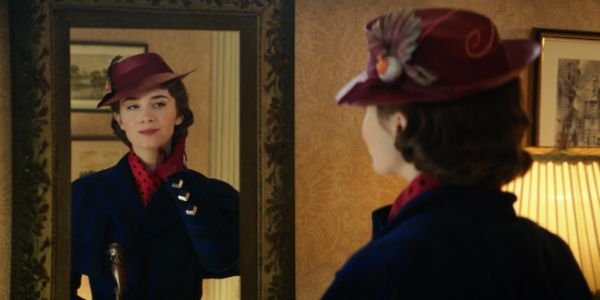 Emily Blunt looking at herself in a mirror in Mary Poppins Returns