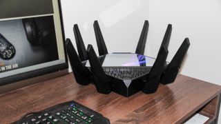 Asus ROG Rapture GT-AXE16000 gaming router on a desk