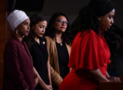 US Representatives Ayanna Pressley (D-MA) speaks as, Ilhan Abdullahi Omar (D-MN)(L), Rashida Tlaib (D-MI) (2R), and Alexandria Ocasio-Cortez (D-NY)