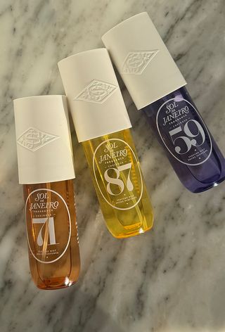 Sol de Janiero 71, 87 and 59 perfume mists on marble surface