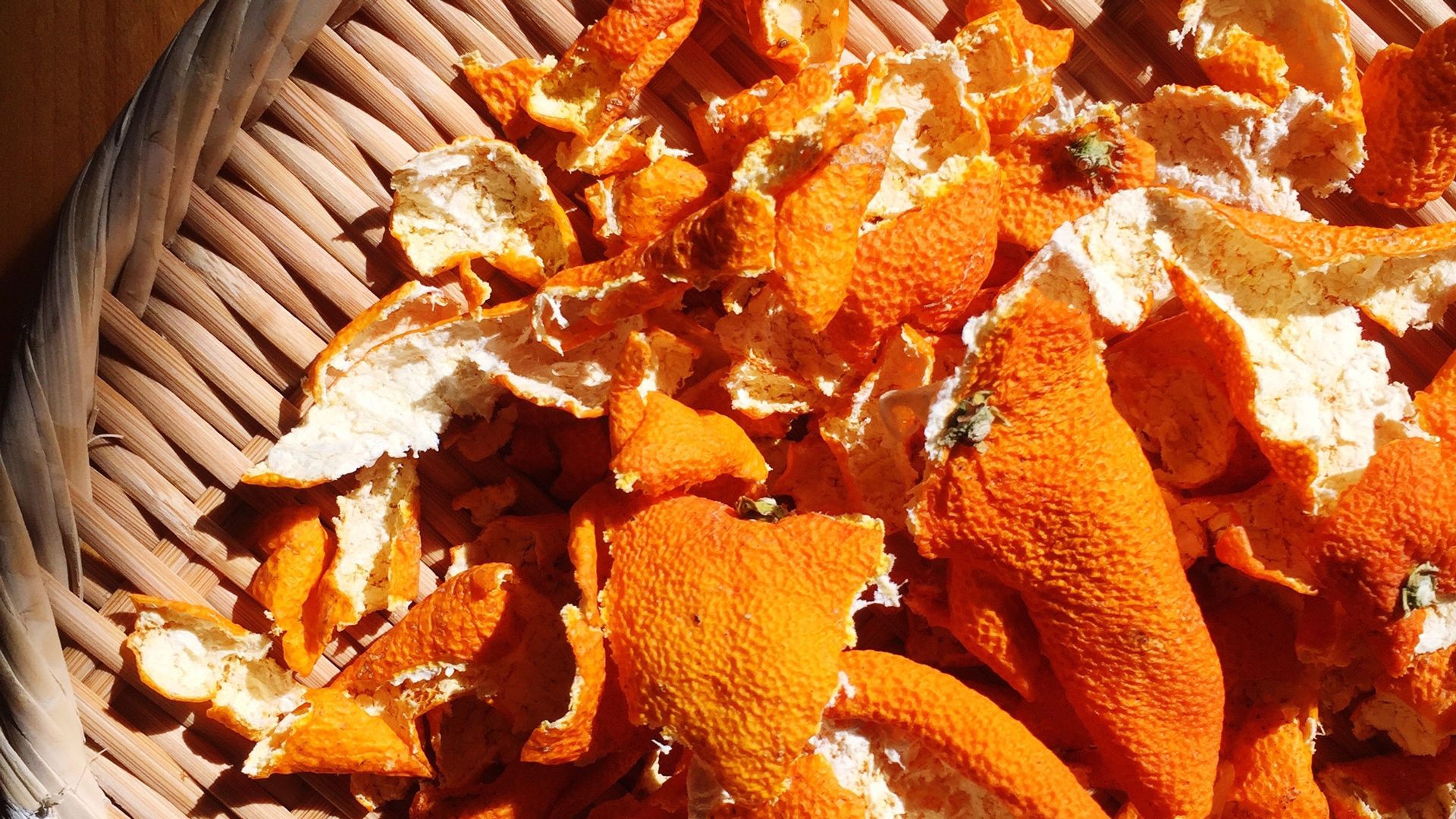 Dried orange peel on a tray as natural solution of how to get rid of spiders