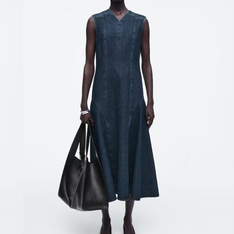 model in a dark denim dress