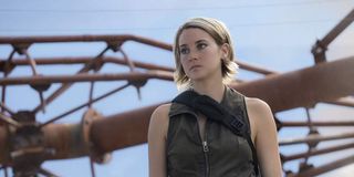 Tris Prior stans in front of a large set of pipes in 'Allegiant'