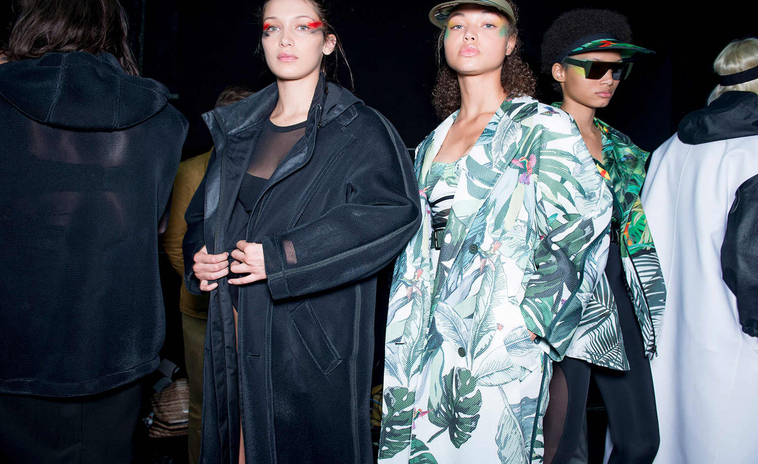 Overcoats worn with matching printed bustier style bathing suits.