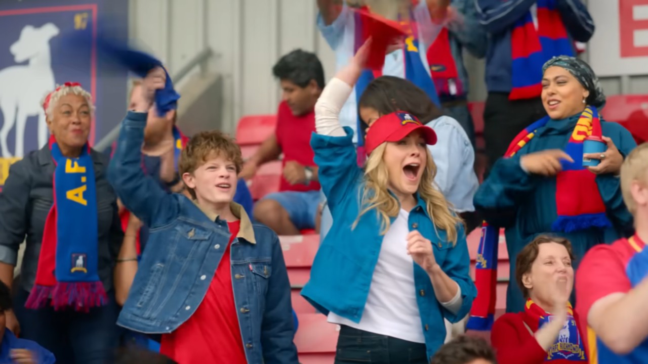 Ted's son and ex-wife in the stands cheering for AFC Richmond.