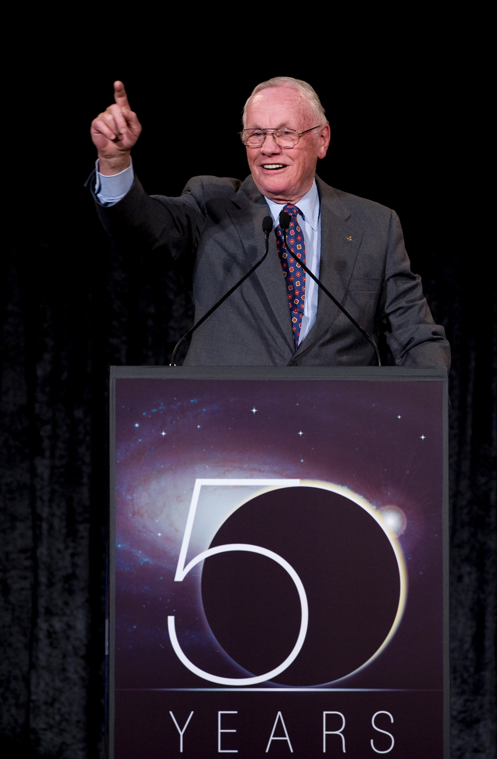 Astronaut. Professor. United States Naval Aviator. First man on the moon. Neil Armstrong, a man who is all these things, addresses guests at the celebration.