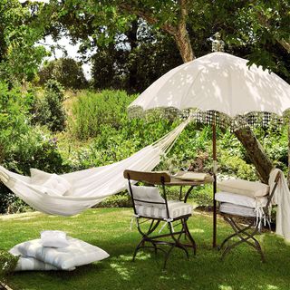 relaxing in luxurious hammock in garden