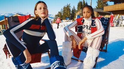 Single Cute Woman In Gray Sweater And White Snow Pants On Skis At