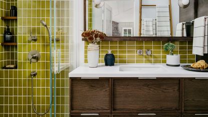 a bathroom with bright green tiles