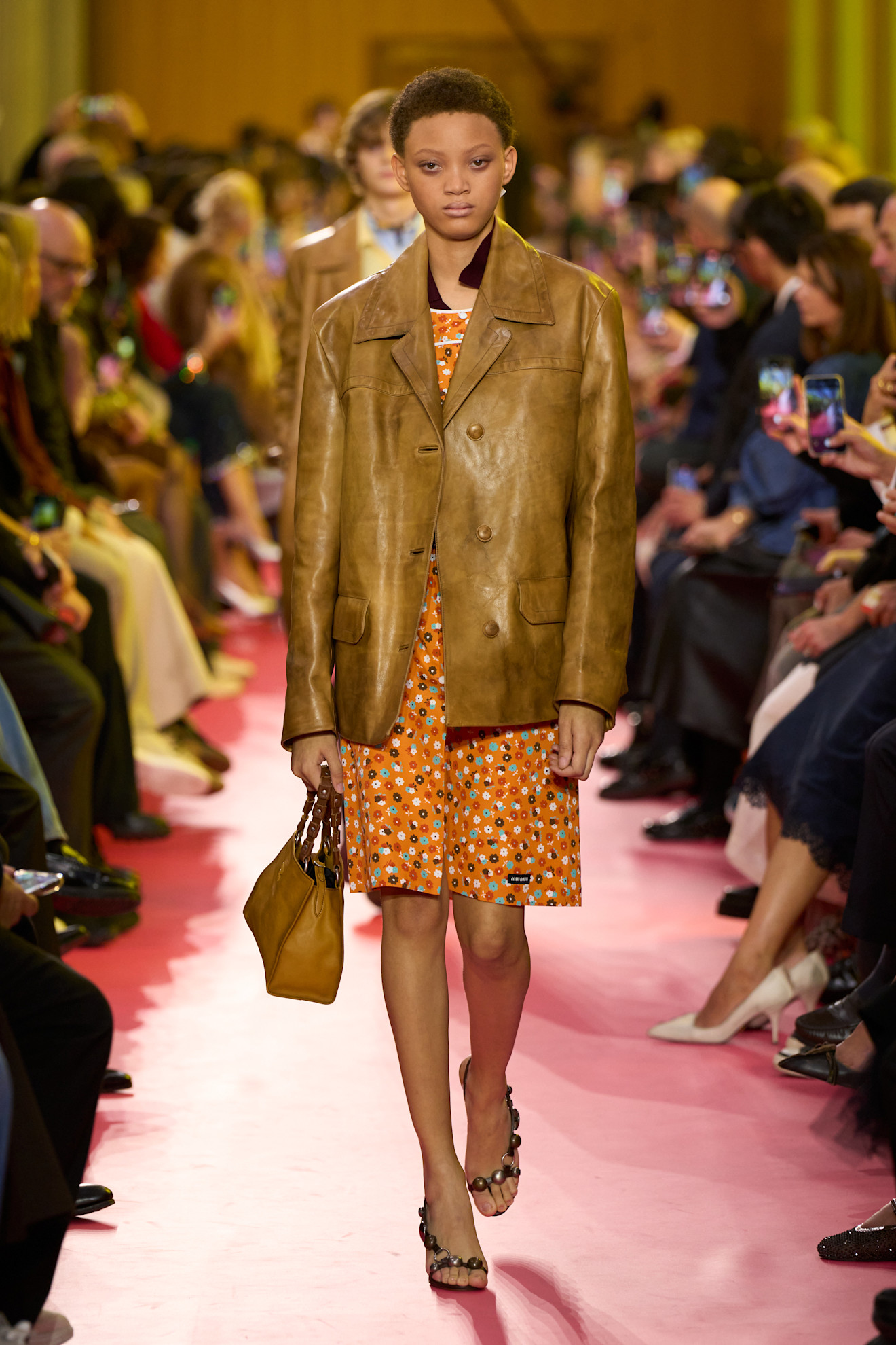 A Miu Miu model wearing a leather blazer in the Spring 2026 show