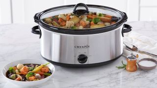One of the best slow cookers, a Crock Pot making stew in a modern white kitchen