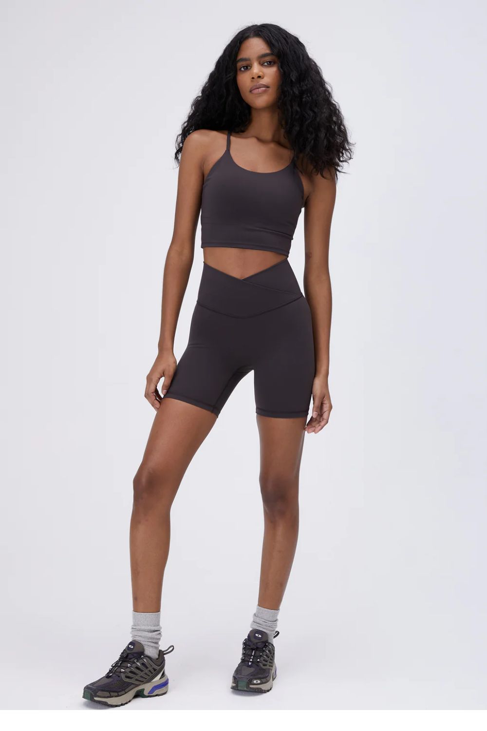 adanola knit sweatshirt woman wearing brown wrap over shorts and longline sports bra