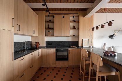A kitchen with storage on walls 