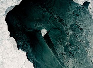 Thin patties of ice called nilas churn around a thicker diamond-shaped chunk of ice in the northern Caspian Sea, as seen in this Landsat 8 image captured on Feb. 4, 2017.