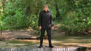 Mike Peters standing in a stream