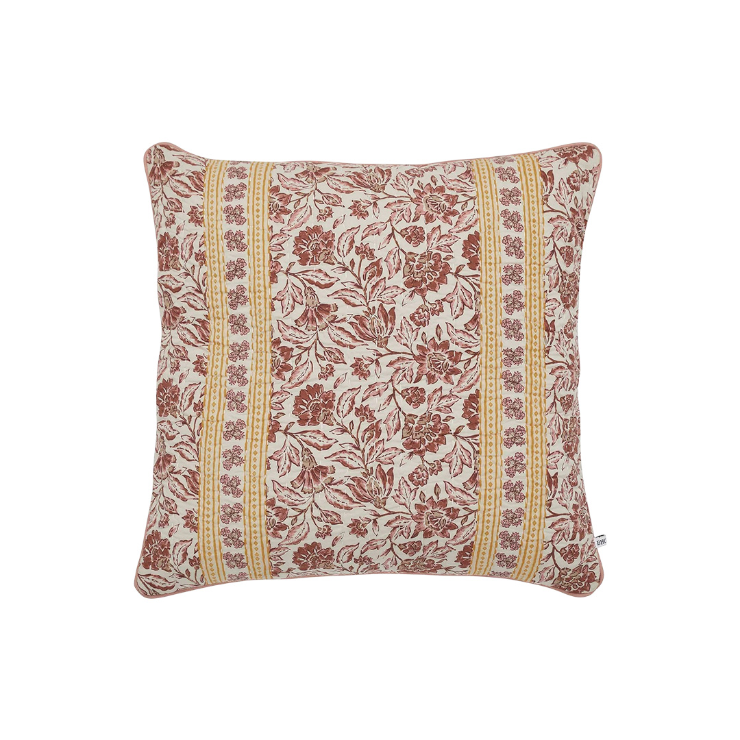 Pink, red, mauve, and yellow throw pillow with yellow stripes down each side and floral pattern 