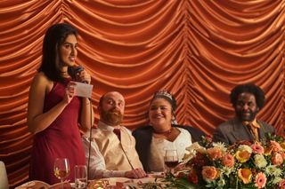 Ambika as Emma giving a wedding speech in One Day.