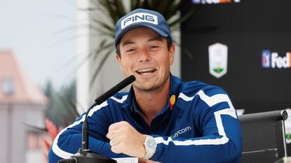 Viktor Hovland smiles and speaks to media at the Genesis Scottish Open during a press conference