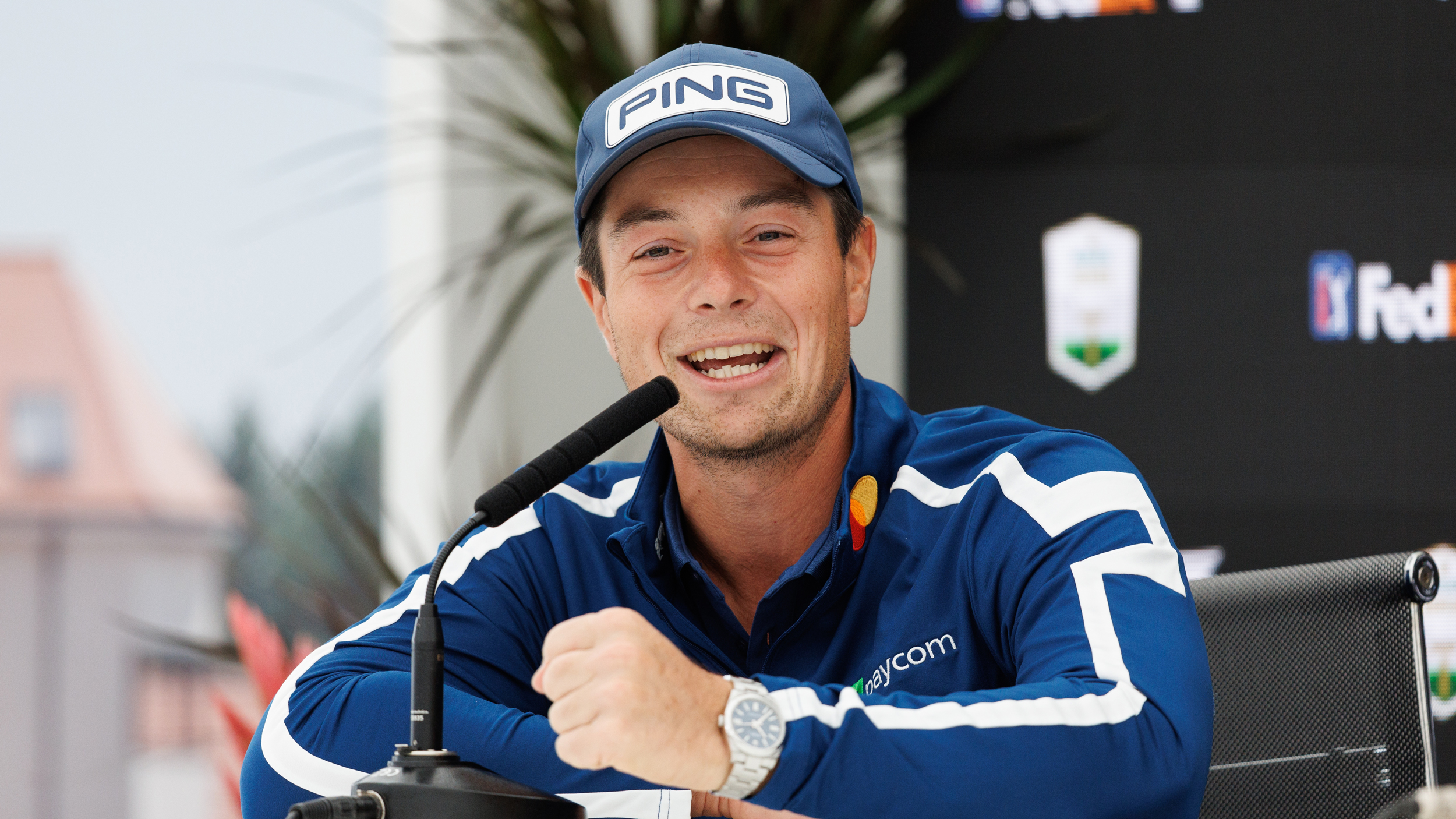 Viktor Hovland smiles and speaks to media at the Genesis Scottish Open during a press conference