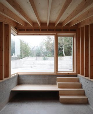 View through large windows to the outside of the Malmesbury House