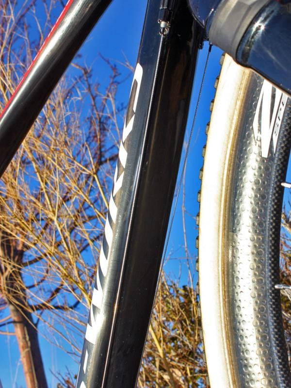 Derailleur cables are run along the down tube.