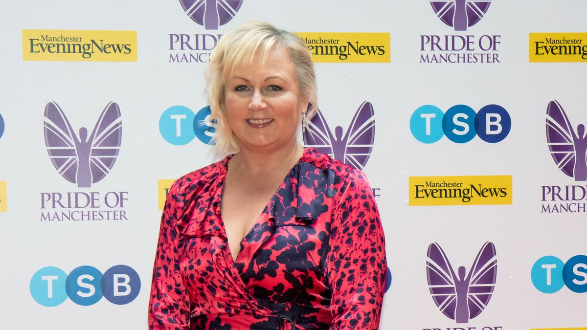 Sue Cleaver on the red carpet wearing a pink dress. 