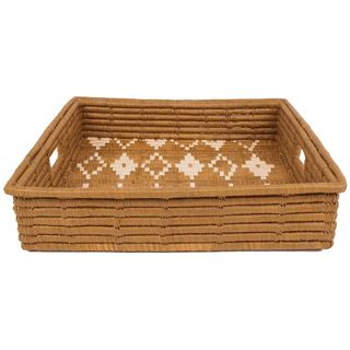 A patterned raffia tray with white detailing