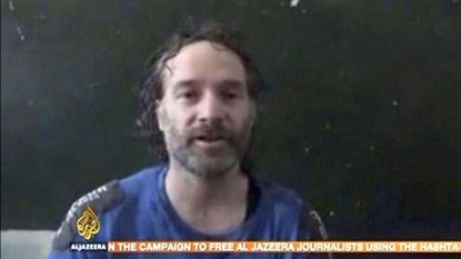 Islamist militants release captive U.S. journalist Peter Theo Curtis in Syria