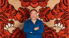 Ai Weiwei with his rug The Tyger, commissioned for Tomorrow’s Tigers and WWF - UK. Curated by Artwise, fabricated by Christopher Farr
