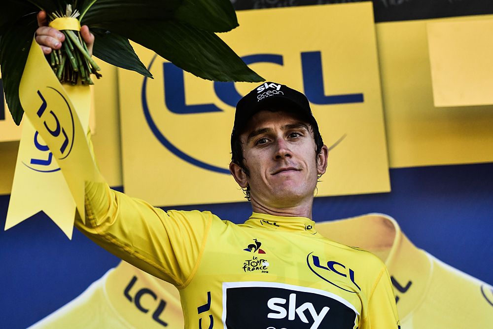 Geraint Thomas (Team Sky) puts on the yellow jersey after stage 16