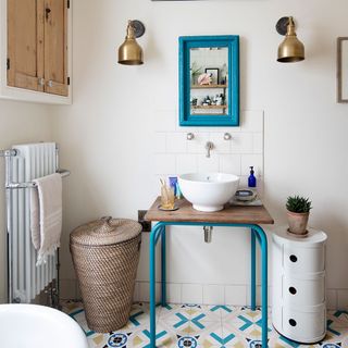 bathroom with white wall designed floor and white wash bain