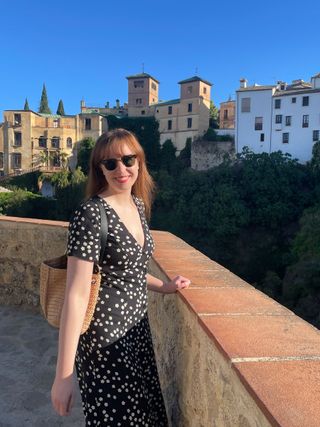 Erin Fitzpatrick wears a black and white dress