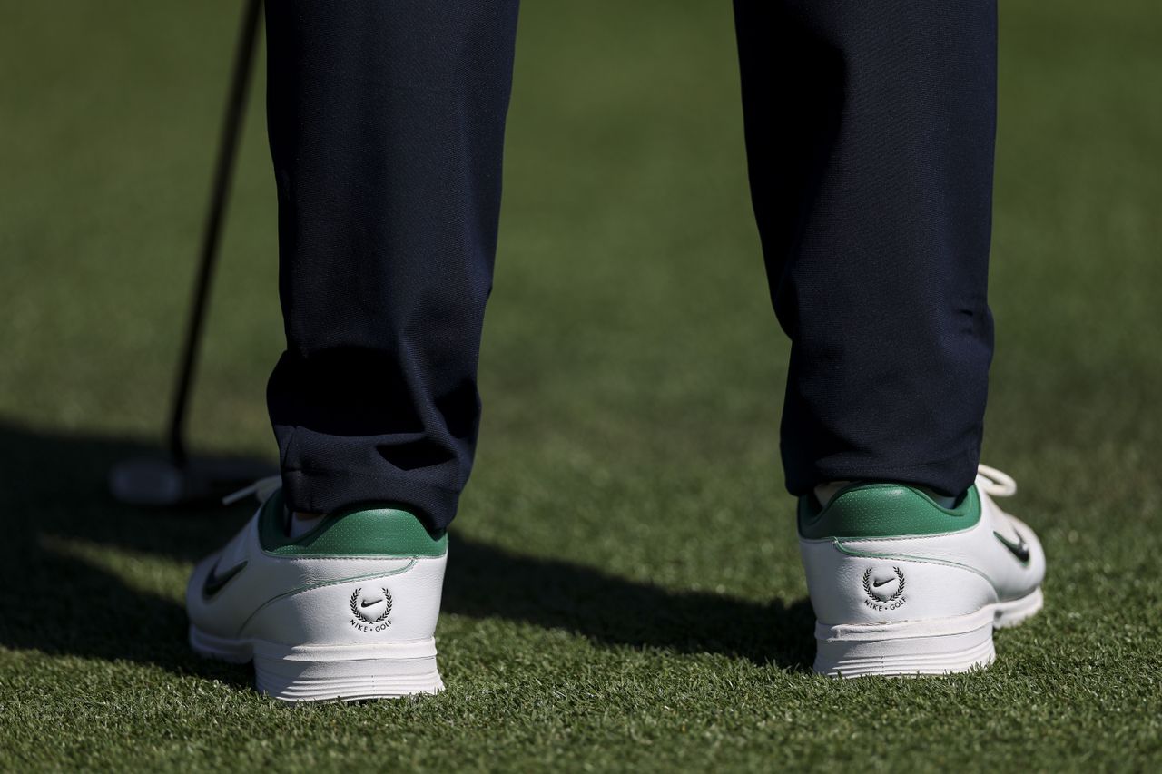 A detailed view of the shoes worn by Rory McIlroy on the 18th green during the first round of the 2026 Masters Tournament at Augusta National Golf Club