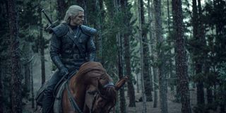Geralt of Rivia on his horse Roach in The Witcher.