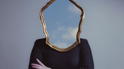 A photo illustration of a woman who has a mirror where her face would be.