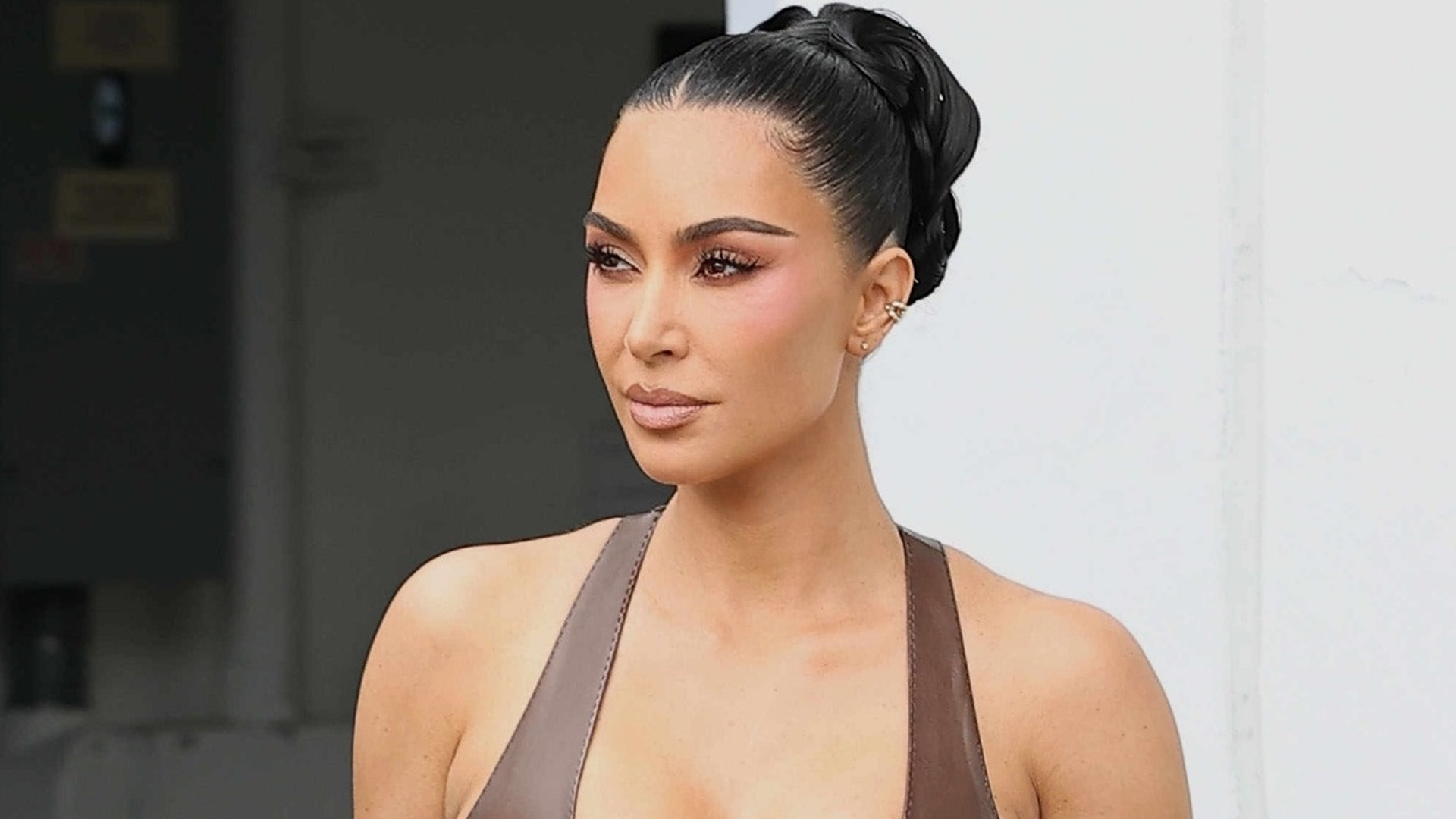 Kim Kardashian was spotted after a L.A. photoshoot in a leather and suede skirt set, plus the leather trench coat trend