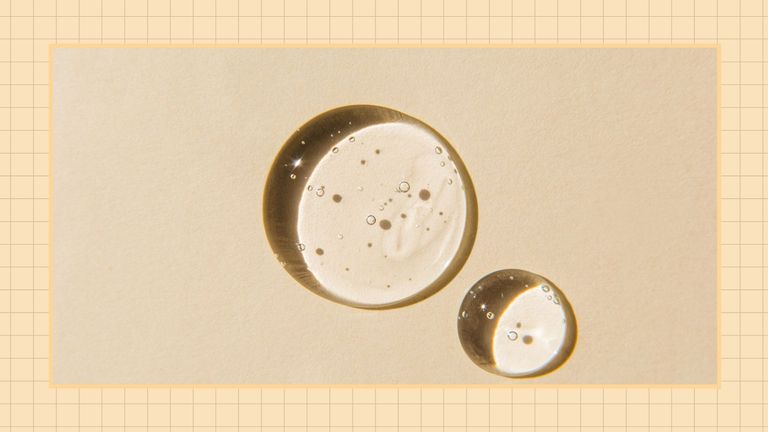 Two transparent drops of skincare gel on beige background to look like skincare antioxidants