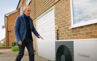 McCloud checks out the heat pump at the property in Peacehaven