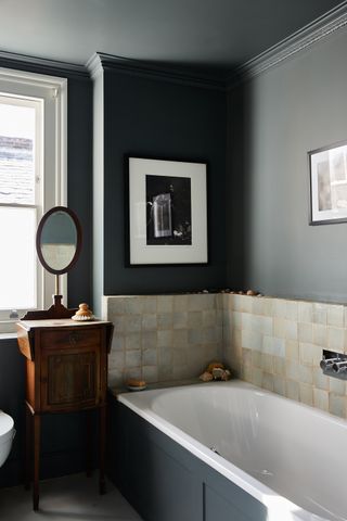 Black bathroom with neutral zellige tiles