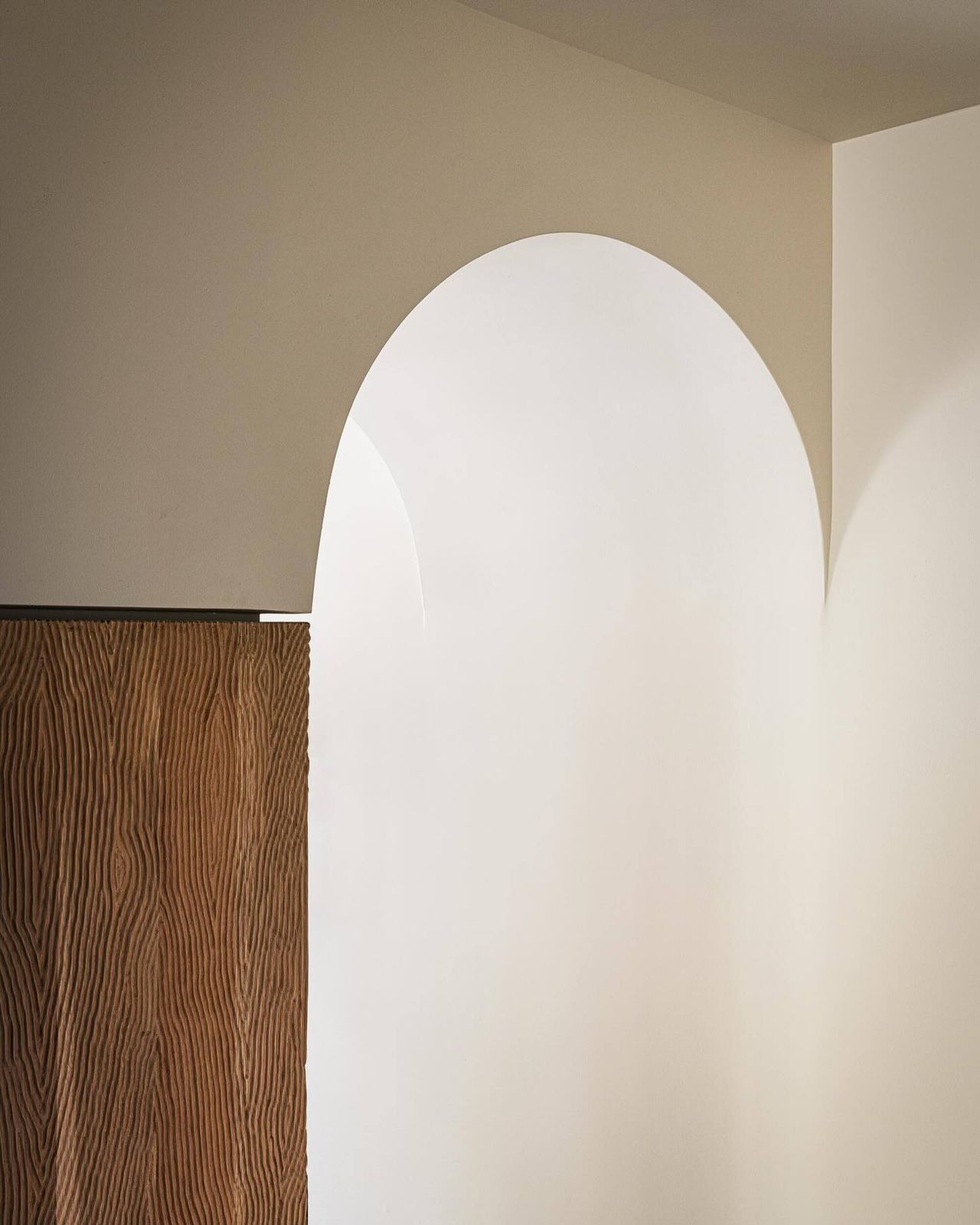 arched doorway and a fluted wood column