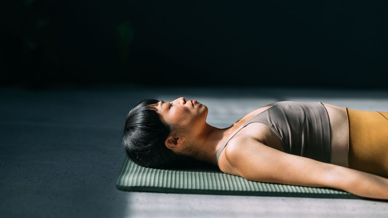 A woman trying the Operation 66 fitness challenge at home