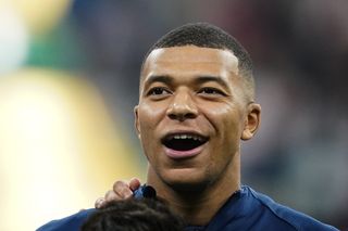 France forward Kylian Mbappe sings the national anthem ahead of his side's World Cup semi-final against England in December 2022.