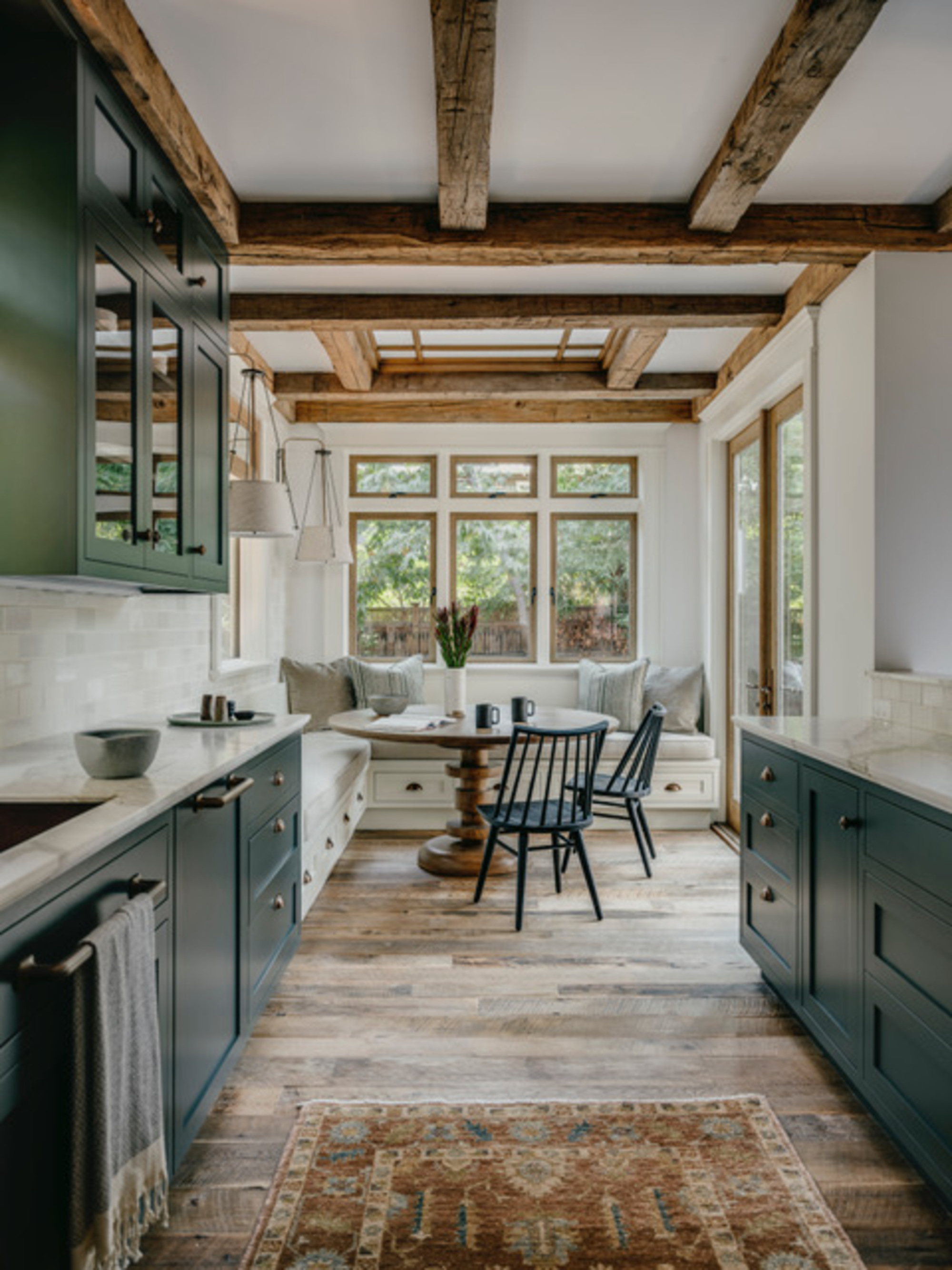 Wooden texture works against olive green cabinetry