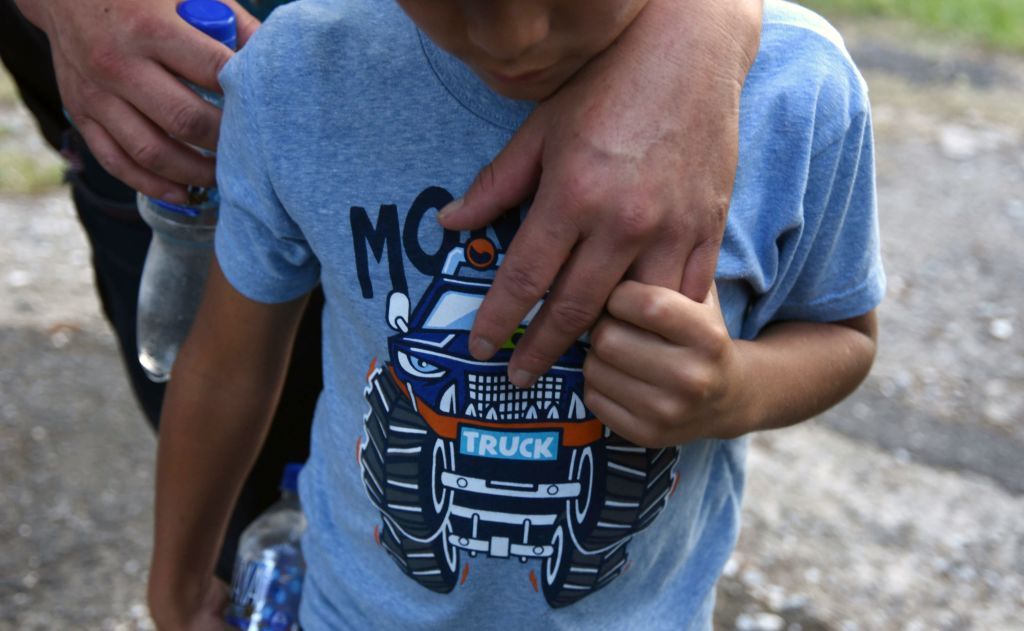 A Guatemalan migrant and his father