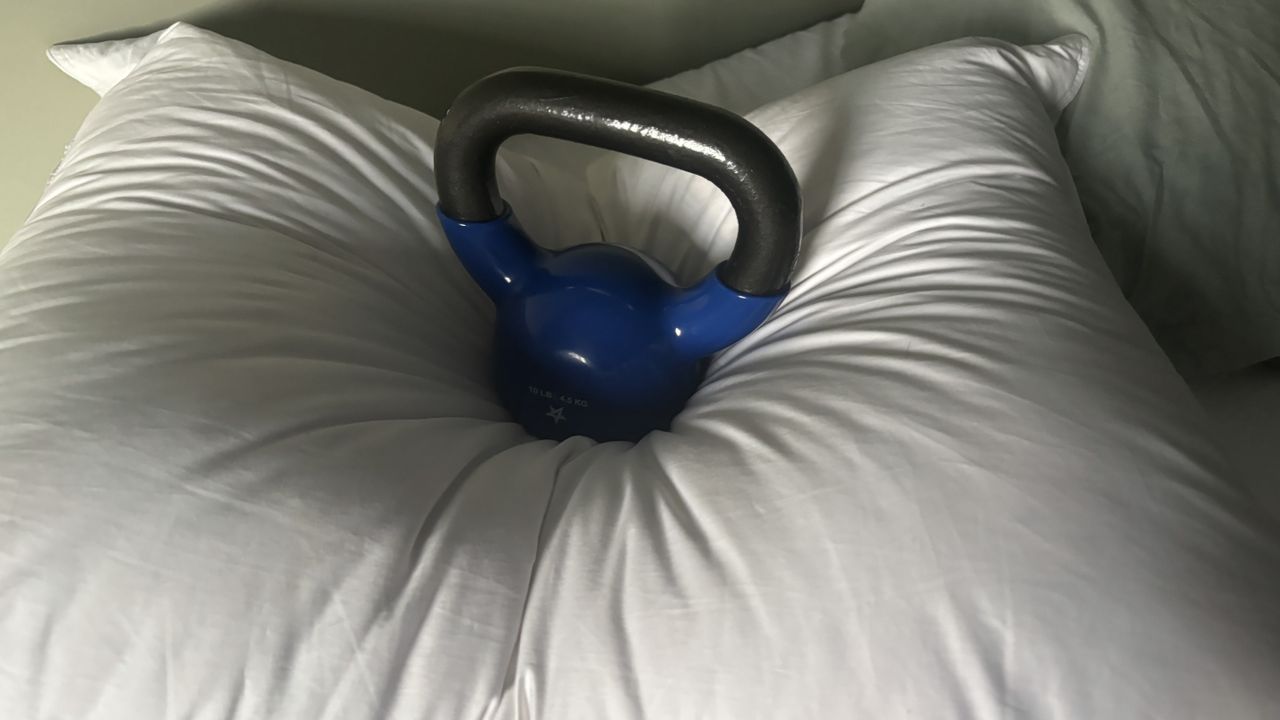 A 10lbs weight is place on the middle of the Helix Down and Feather Pillow to test its responsiveness.